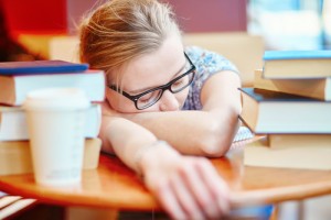 girl sleeping on a desk